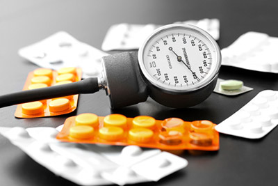blood pressure meter and pills on the table
