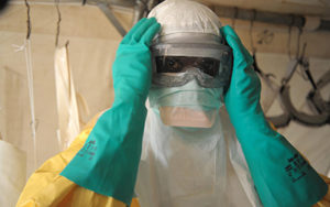 Health specialists prepare for work in an isolation ward for patients at the Doctors Without Borders facility in GuÃkedou, southern Guinea. Guinea's President Alpha Conde warned of a "health emergency" as authorities raced to contain a spiraling Ebola epidemic which has killed 78 people and prompted neighboring Senegal to close its border. AFP PHOTO / SEYLLOUSEYLLOU/AFP/Getty Images